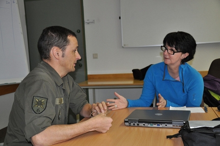 Lieutenant Colonel Klaus Zweiker explains the ropes to Elizabeth Alcock